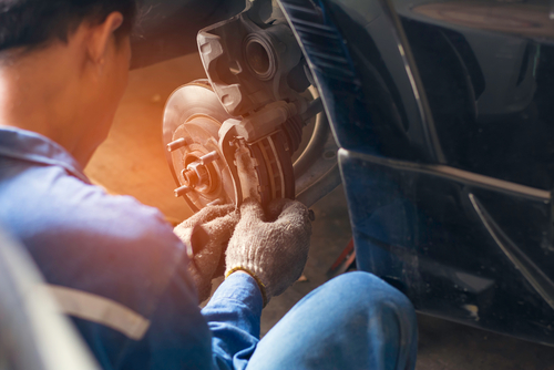 mechanic working on brakes